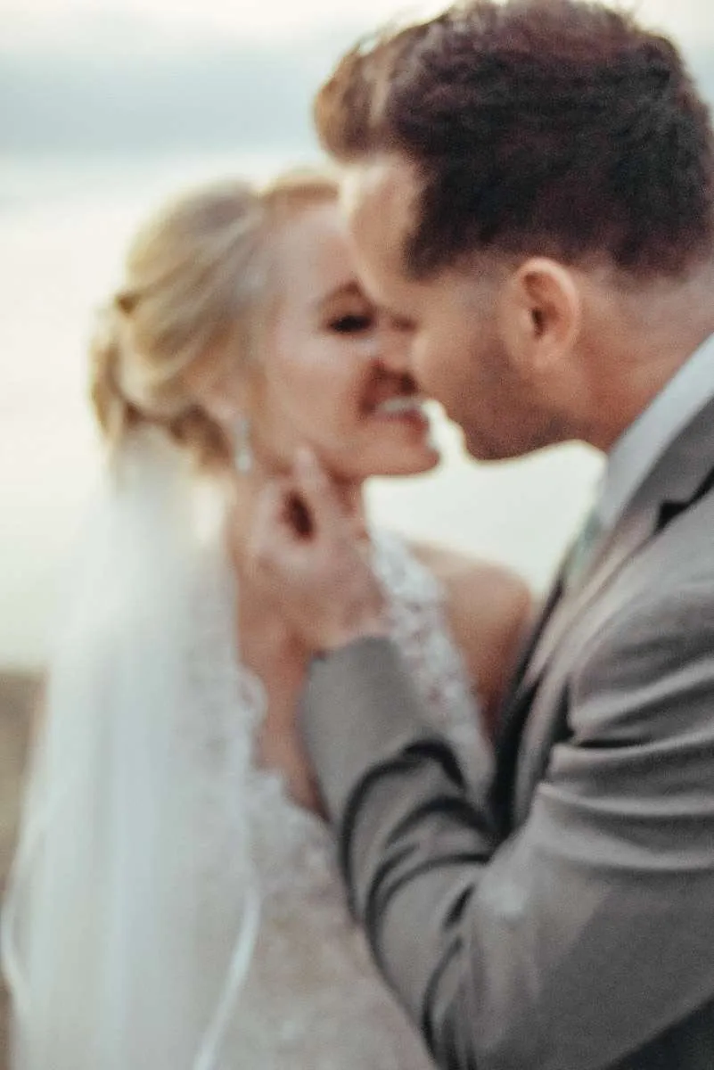 Portrait of a couple forehead to forehead in golden evening light